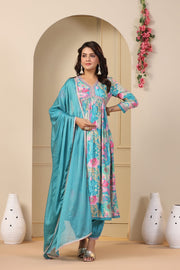 This Anarkali gown in cotton maslin features a digital shine print with embroidery. It has a V-neck, full sleeves, and a length of 52-55 inches. The set includes the gown and a dupatta. Machine washable for easy care and shop now at Shoppers Trend .